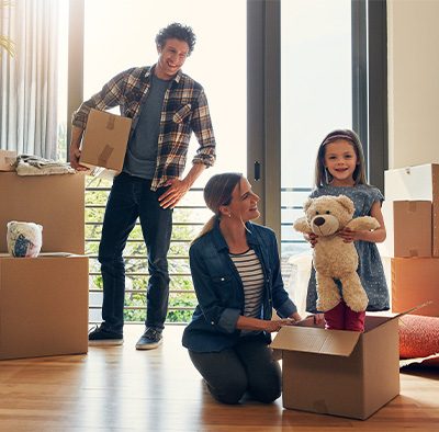 Young family unpacking in their new home in the Triangle.